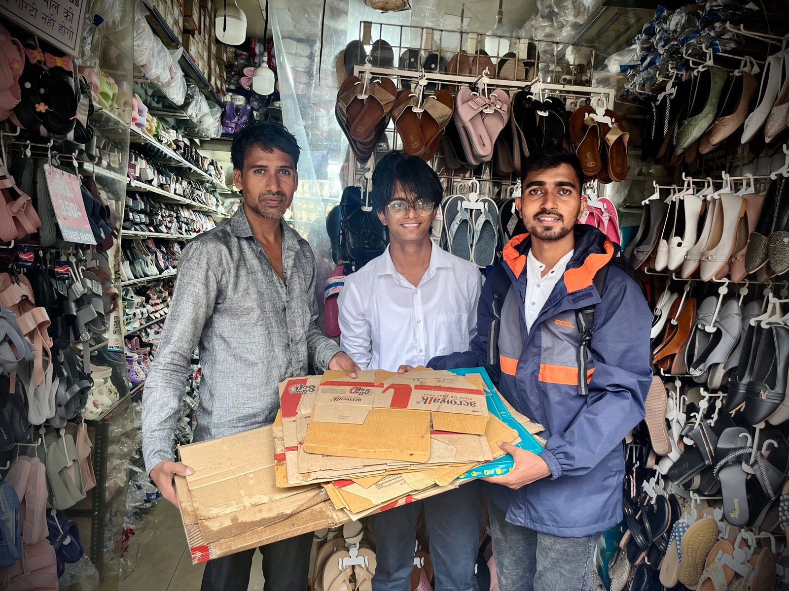 Volunteers collecting waste wrappers from local shops