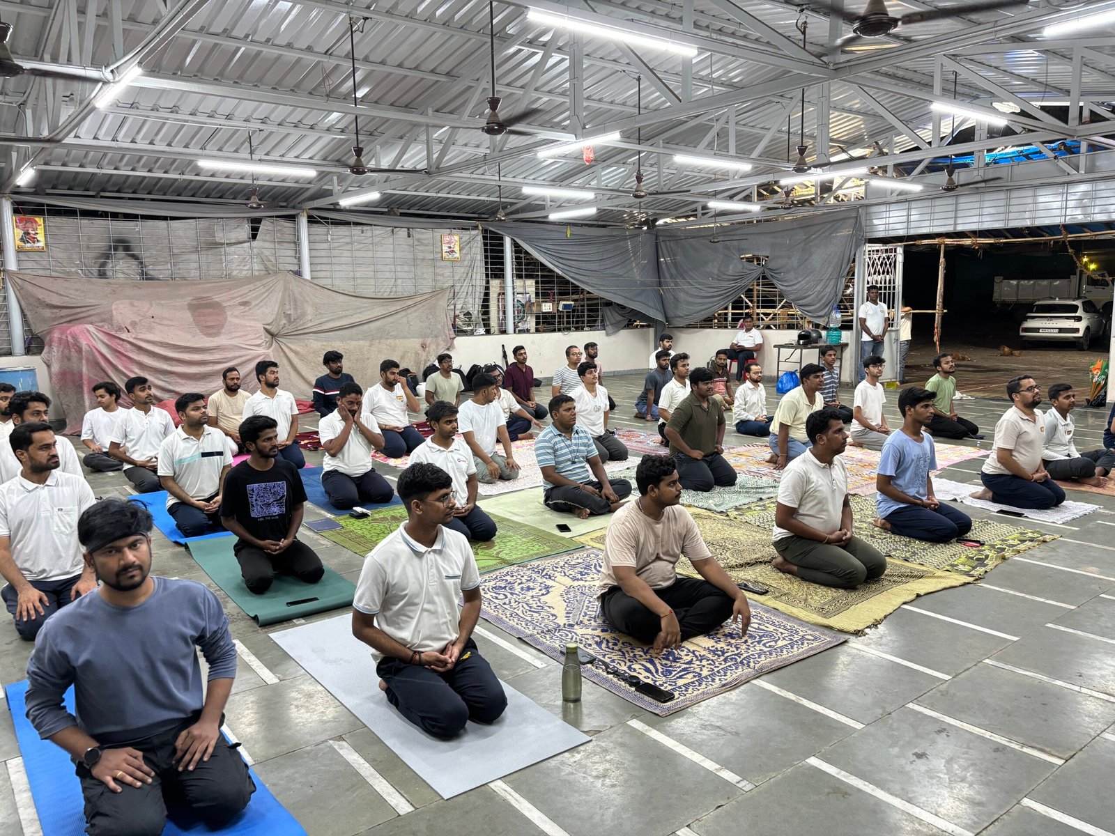 Participants performing yoga during Yoga Day session